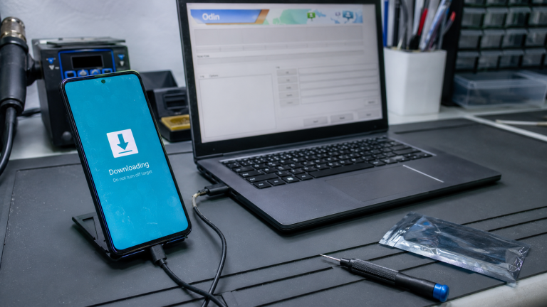Galaxy A53 disconnects during Odin flash USB check shown as a realistic Android repair desk troubleshooting scene